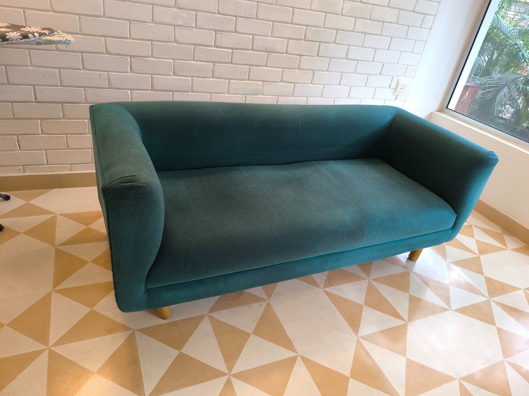 The same sofa after deep shampooing, colour restored